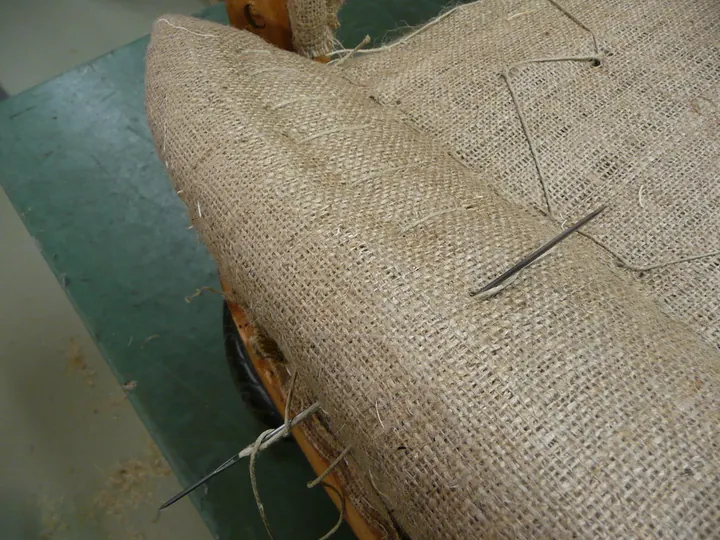 Stitched edges, on a 1920s parlor chair in the shop